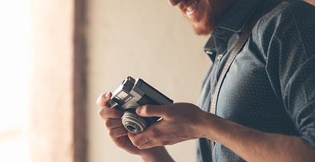 A man smiles at his camera