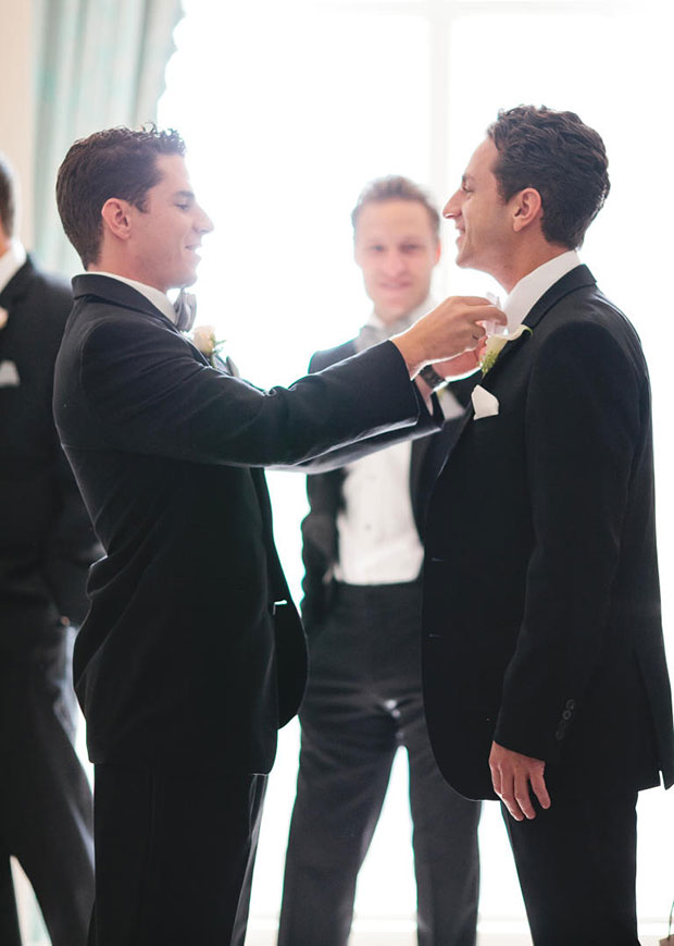 Happy handsome groom and groomsmen posing and smiling, standing on the  background of pine forest Stock Photo by sofiiashunkina