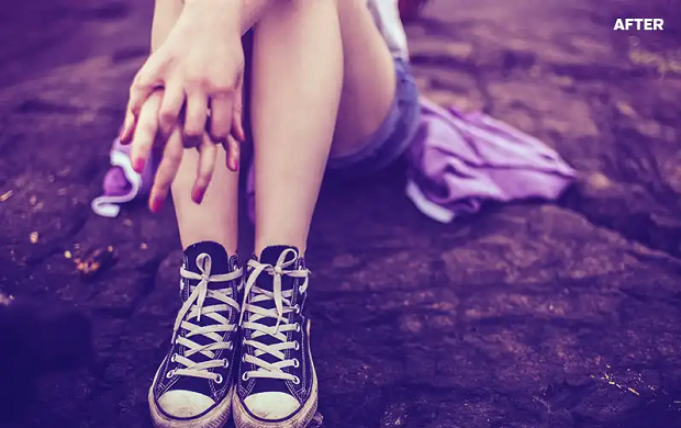 An example of the Blue Evening Photoshop plugin, used on an image of a girl sitting on a rock