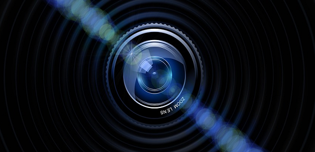 A close-up image of a camera zoom lens