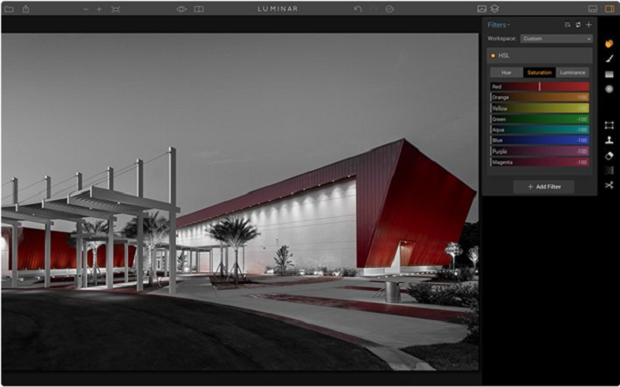 A large, bold red building against a grey sky