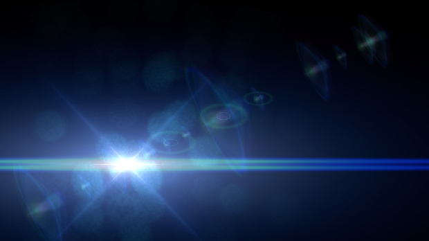 A bright lens flare against an empty, dark background