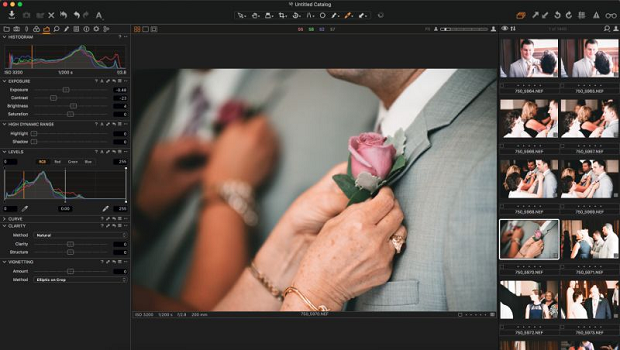 An image of a woman pinning a rose to a man's suit, loaded into the Capture One interface