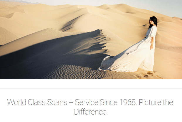 Photovision's homepage, with a woman standing in the middle of the desert in a flowing dress