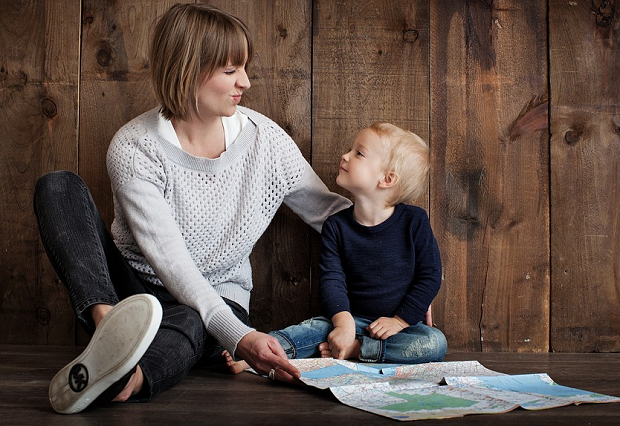 A mom and her son looking over a map together