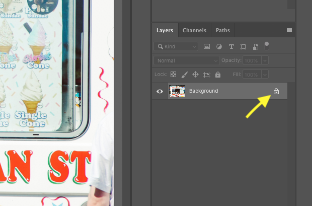 Close up of locked background image in Photoshop with yellow arrow pointed at padlock icon