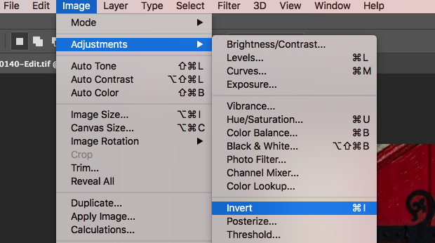 "Invert" option selected from "Adjustments" under Photoshop's "Image" toolbar option