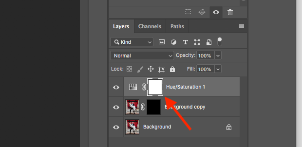 Red arrow pointed at white mask in a Hue/Saturation adjustment layer in the Layers Panel of Photoshop 