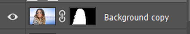 Layer mask attached to the portrait image blacks out the background