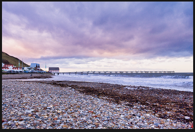 beach landscape photo with cloudy, pink and purple sky