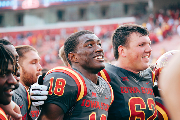 Smiling football players after a game