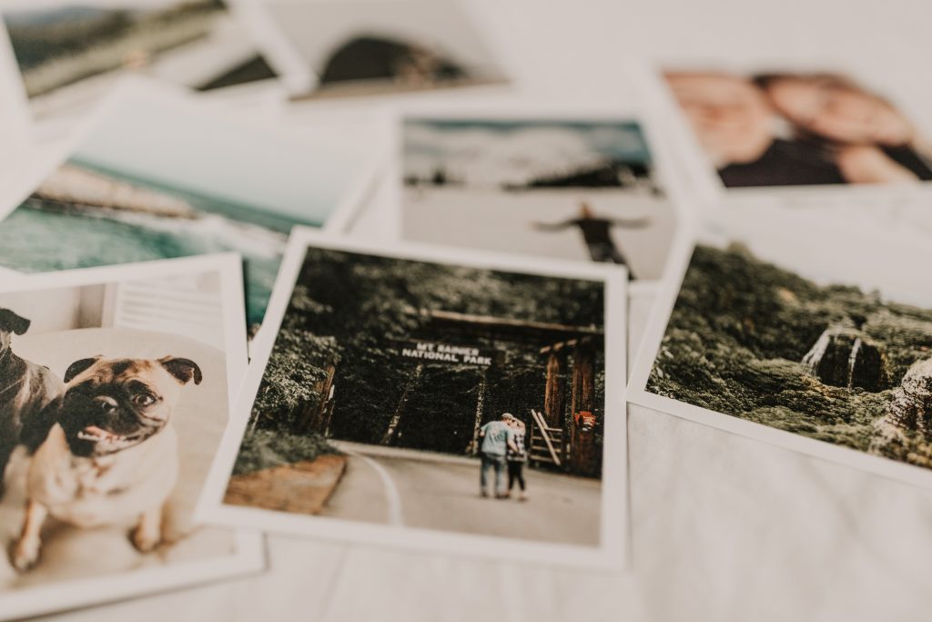 Polaroid prints placed on top of a white paper