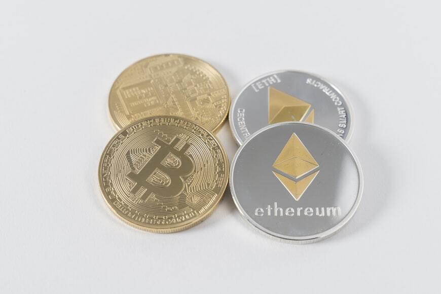 4 silver and gold colored ethereum and bitcoins