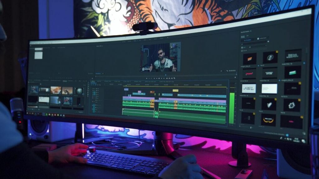 An ultra wide PC screen displaying Adobe Premiere Pro software