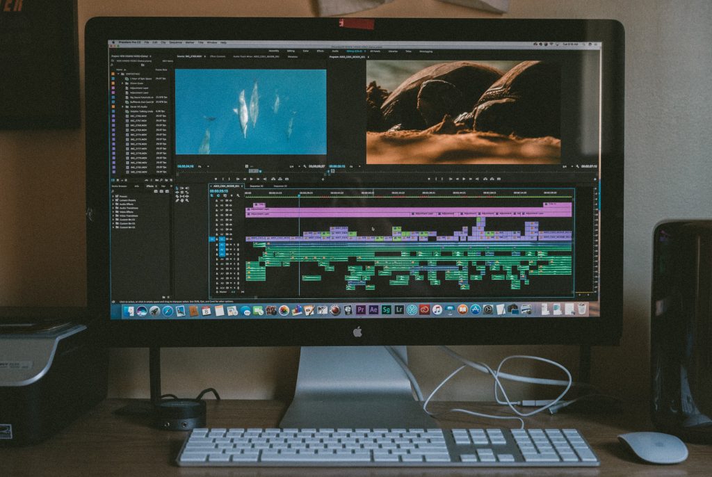 Black iMac screen displaying a video editing software 