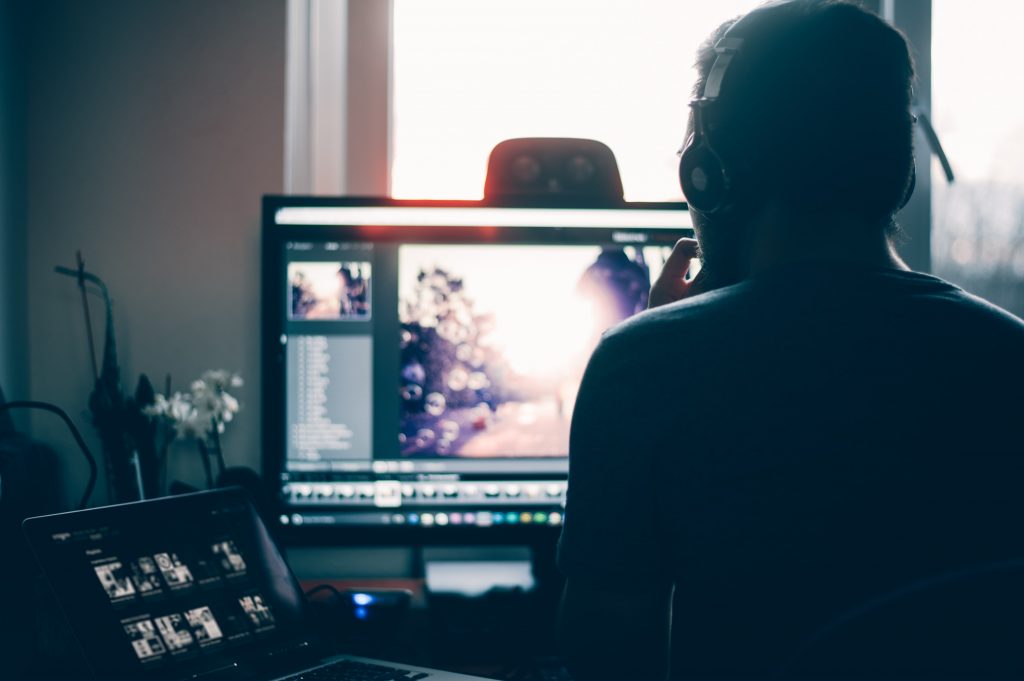 Over the shoulder shot of a person working on Adobe Lightroom